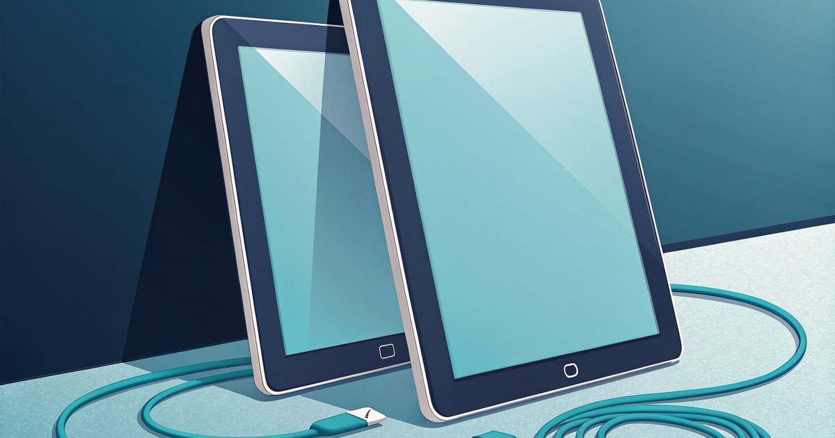 Deux tablettes cote a cote reliees par un cable